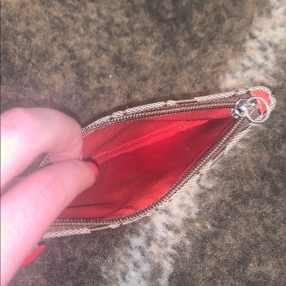Brown and orange coach wristlet